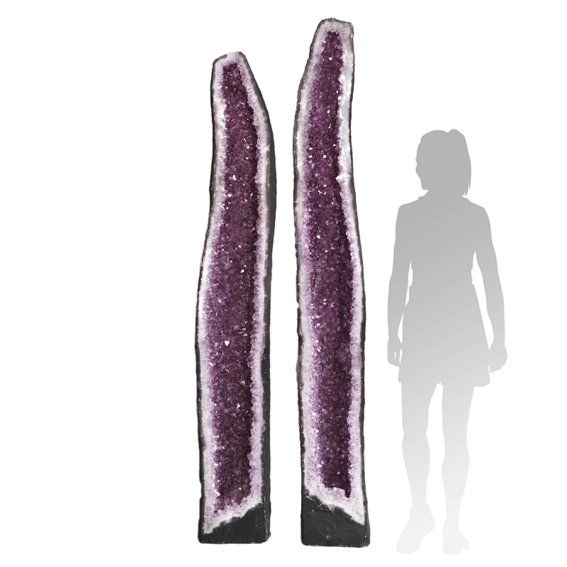 Amethyst cave showing polished crystal interior in matching geode pair.