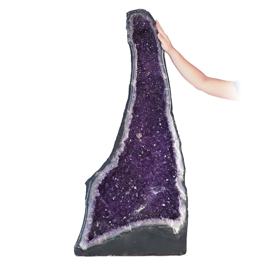 Amethyst crystal cathedral with deep violet points and natural outer shell.