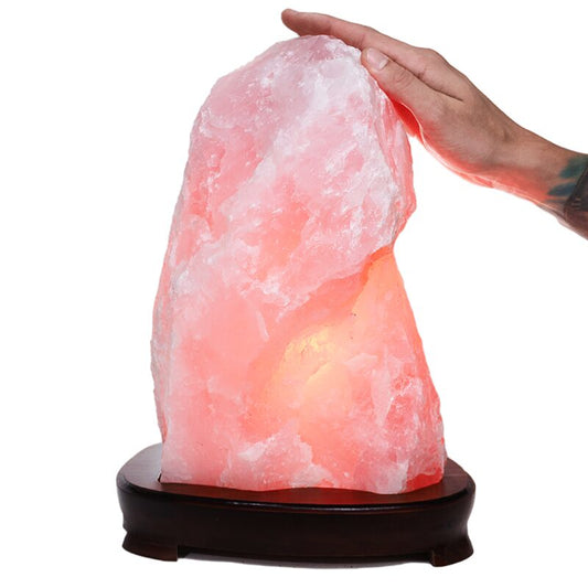 Crystal lamp with soft pink glow, made of natural rose quartz.
