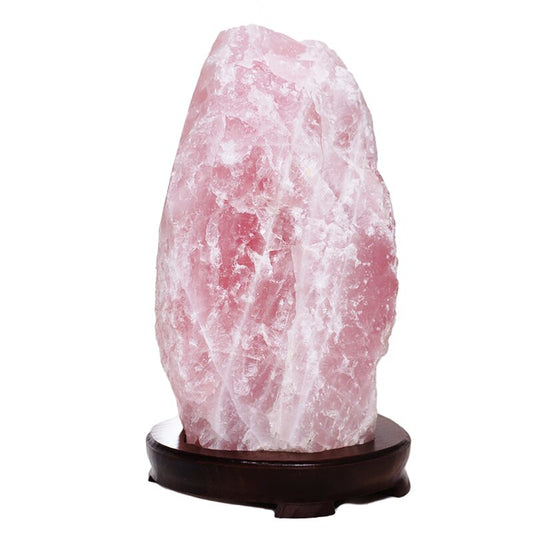 Rose quartz lamp with soft pink crystal lit from within.